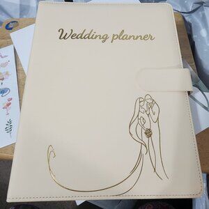 Wedding Planner has everything to keep everything in one place.  New in Box